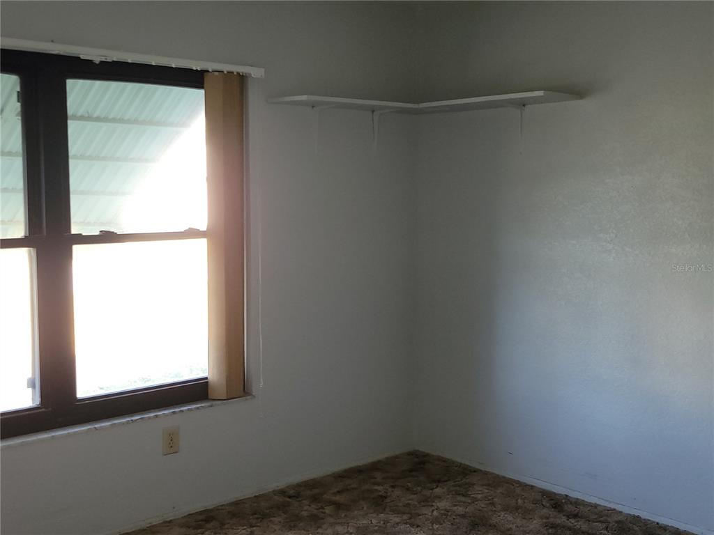 653 Atlas Avenue Northeast Palm Bay, FL 32905 - Photo 9 of 24 a small space with a window