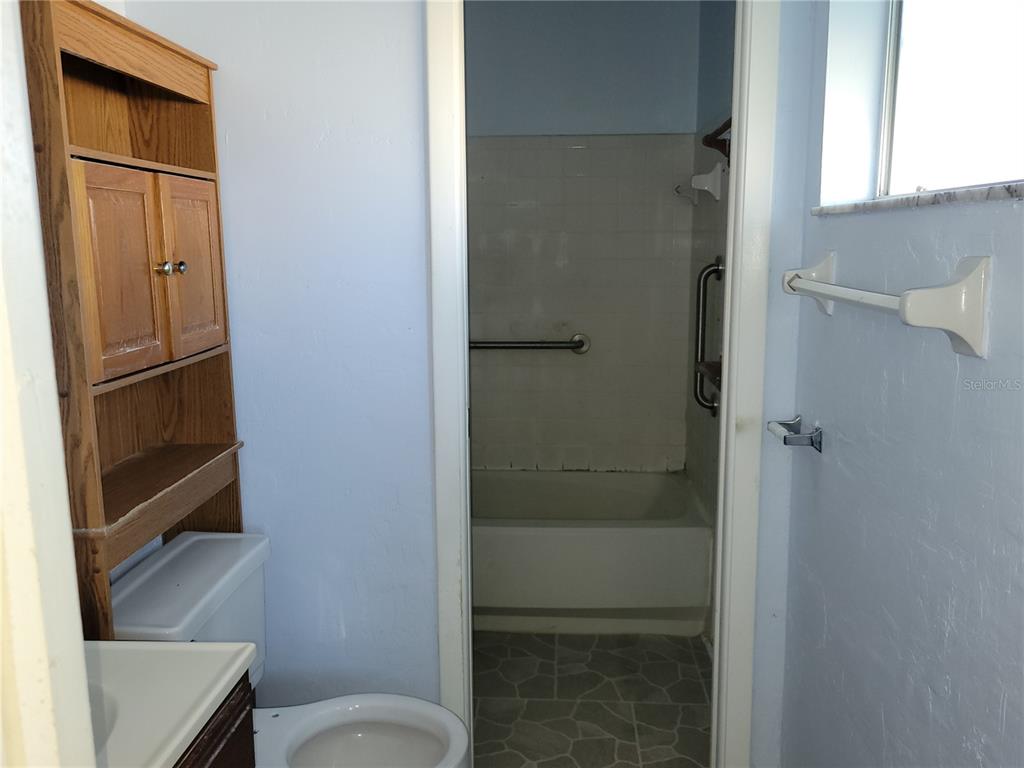 653 Atlas Avenue Northeast Palm Bay, FL 32905 - Photo 10 of 24 a bathroom with a shower
