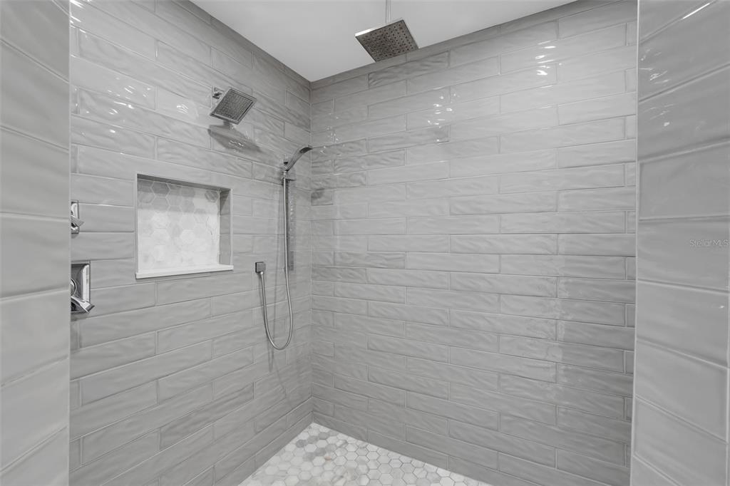 3862 Beacon Ridge Way Clermont, FL 34711 - Photo 18 of 56 a bathroom with a shower