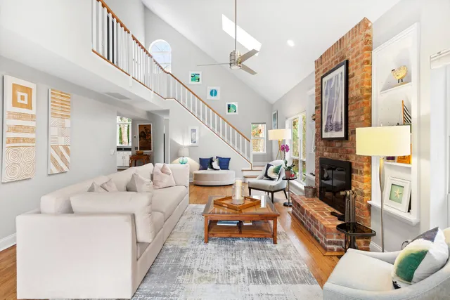 a living room with furniture or couch and a fireplace