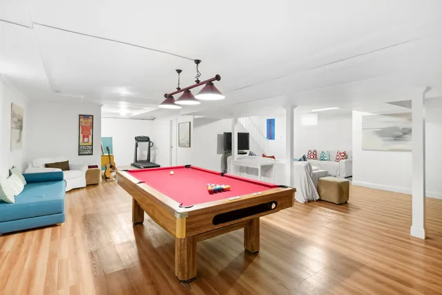 a living room with furniture and flat screen tv