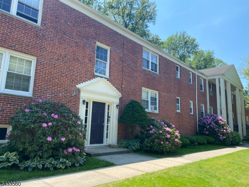 390 Morris Avenue, Unit 4 Summit, NJ 07901 - Photo 11 of 11 a front view of a house with garden