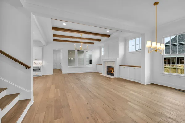 a view of an empty room and fire place