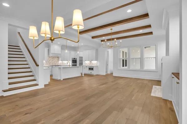 a view of kitchen with kitchen island and stainless steel appliances