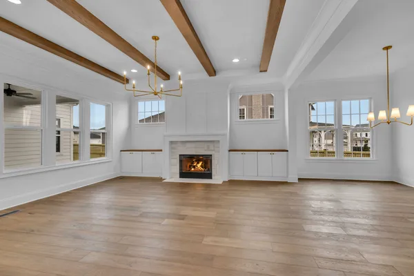 a kitchen with kitchen island granite countertop white cabinets and stainless steel appliances