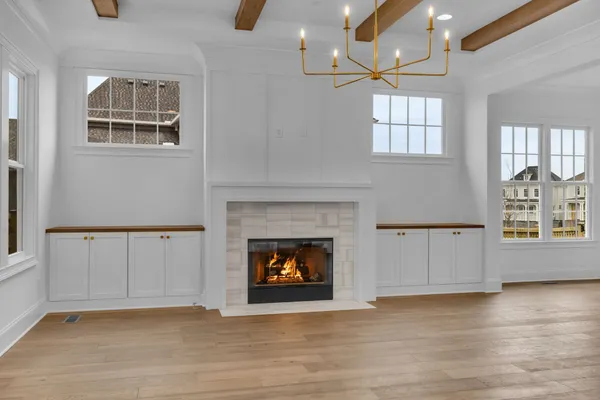 a kitchen with stainless steel appliances granite countertop a sink a stove and a wooden floors