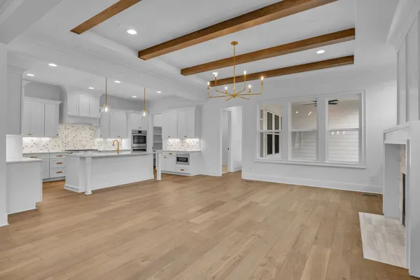 a kitchen with granite countertop a stove and a sink