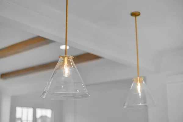 a view of an empty room with wooden floor and closet