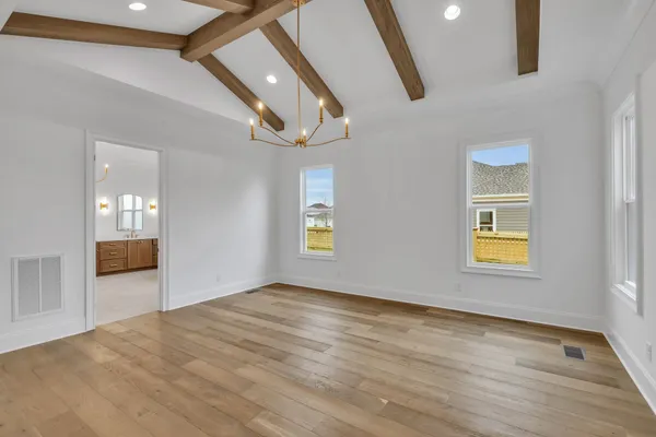 a view of house with backyard and garden