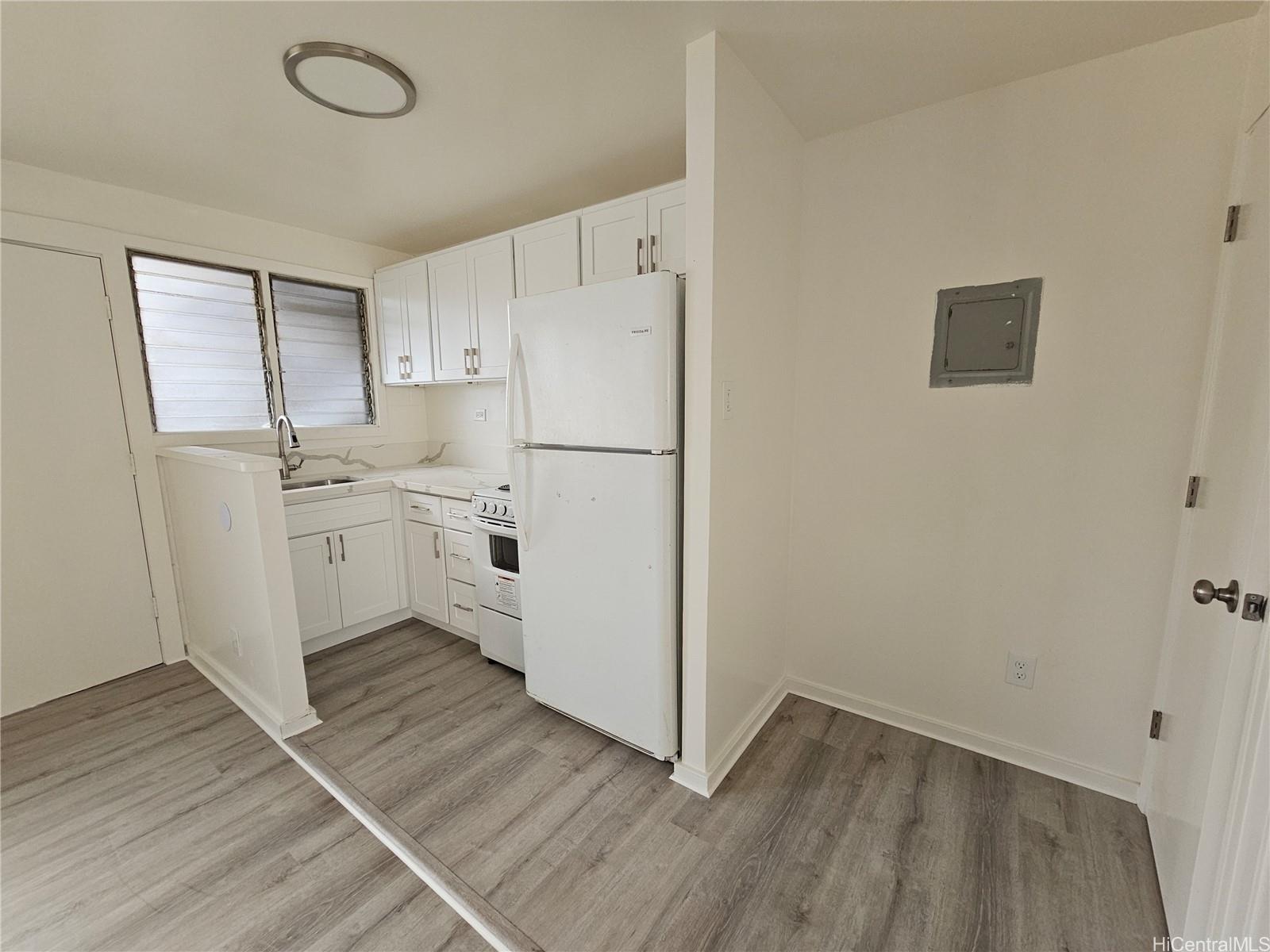a kitchen with a refrigerator a sink and dishwasher