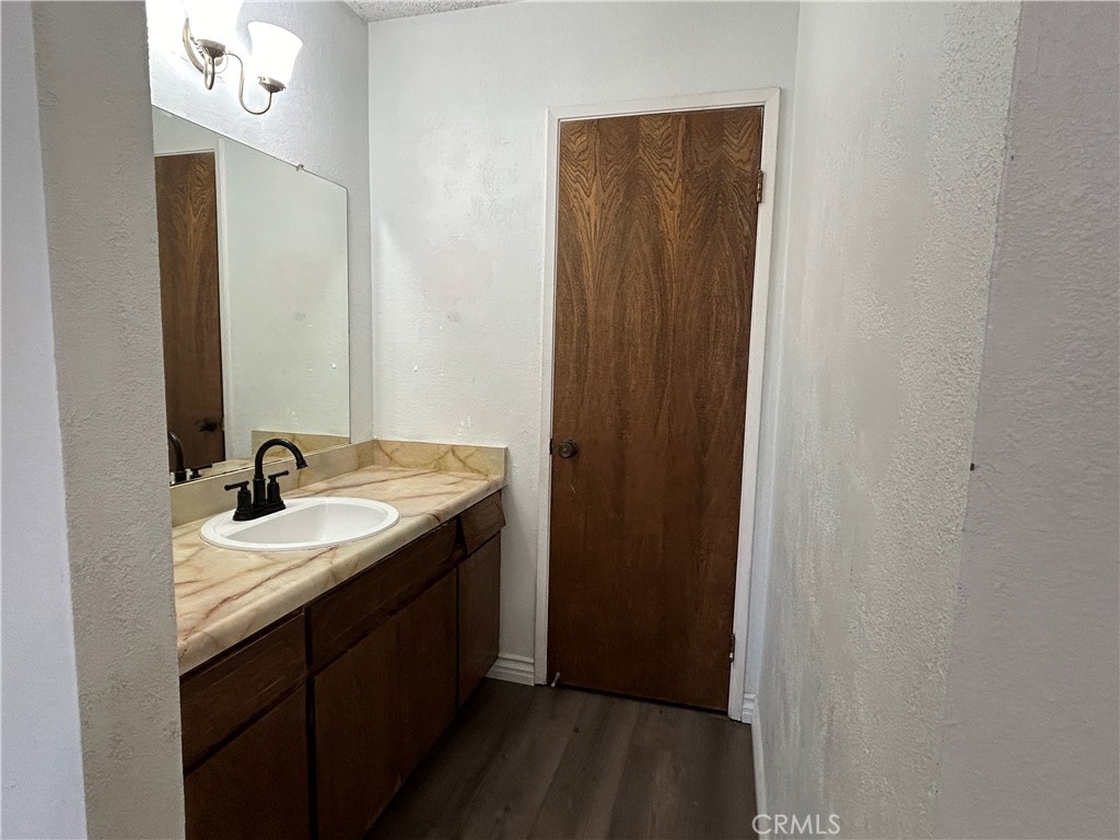 511 D Street Upland, CA 91786 - Photo 14 of 23 a bathroom with a sink and a mirror