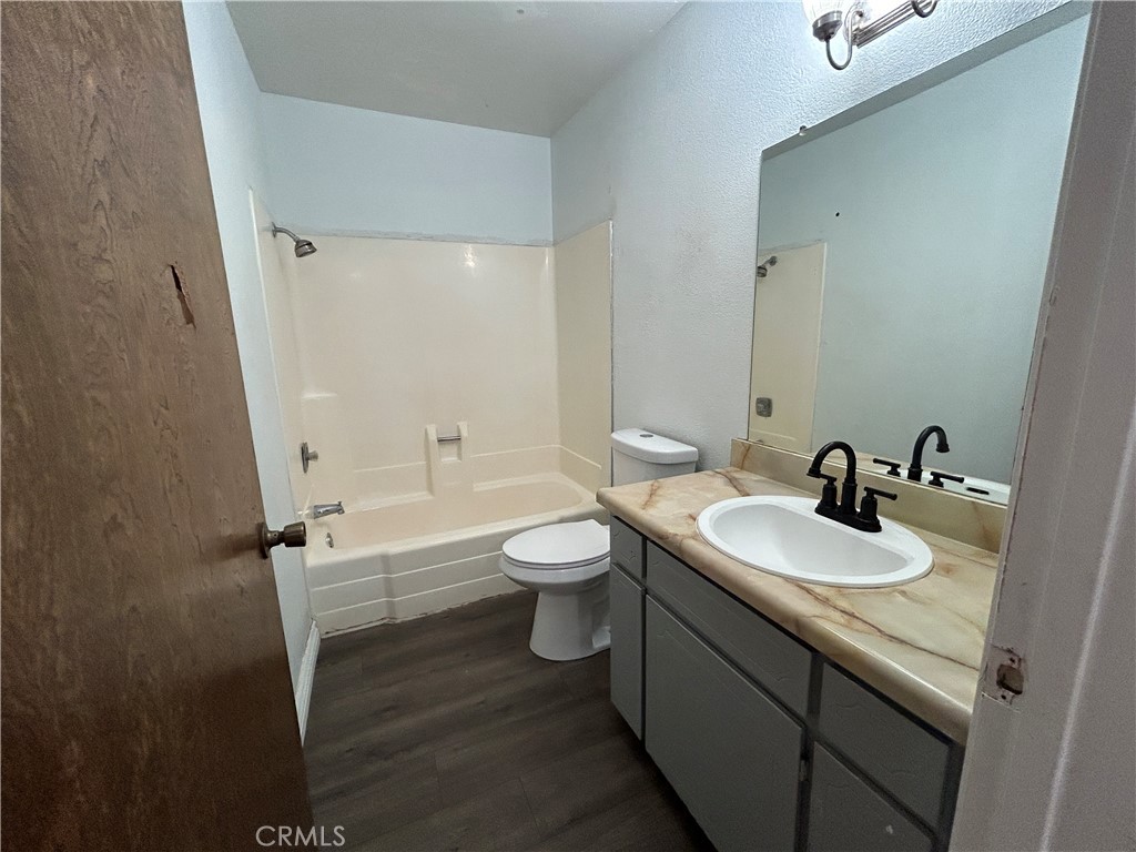 511 D Street Upland, CA 91786 - Photo 17 of 23 a bathroom with a toilet sink and mirror