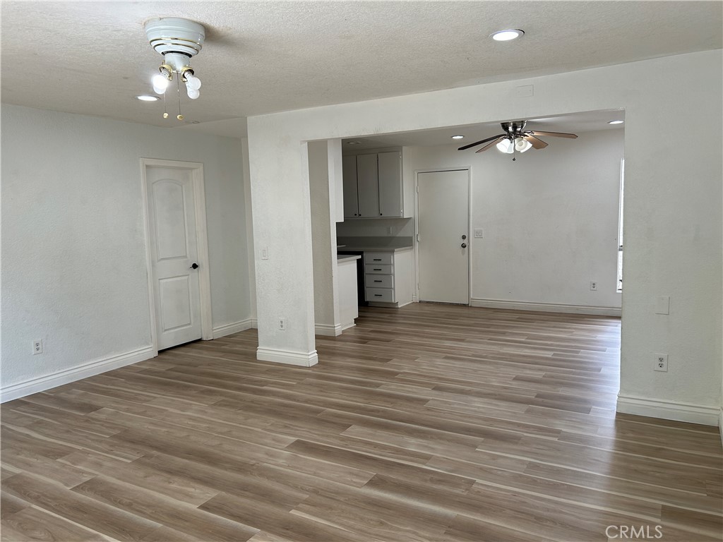 511 D Street Upland, CA 91786 - Photo 4 of 23 wooden floor in an empty room with a window