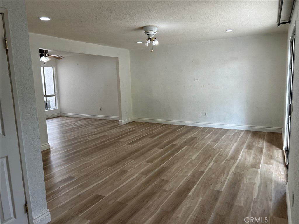 511 D Street Upland, CA 91786 - Photo 7 of 23 wooden floor in an empty room with a window