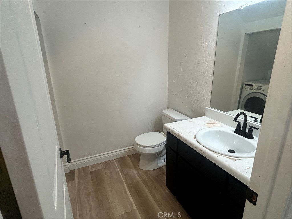 511 D Street Upland, CA 91786 - Photo 8 of 23 a bathroom with a sink toilet and mirror