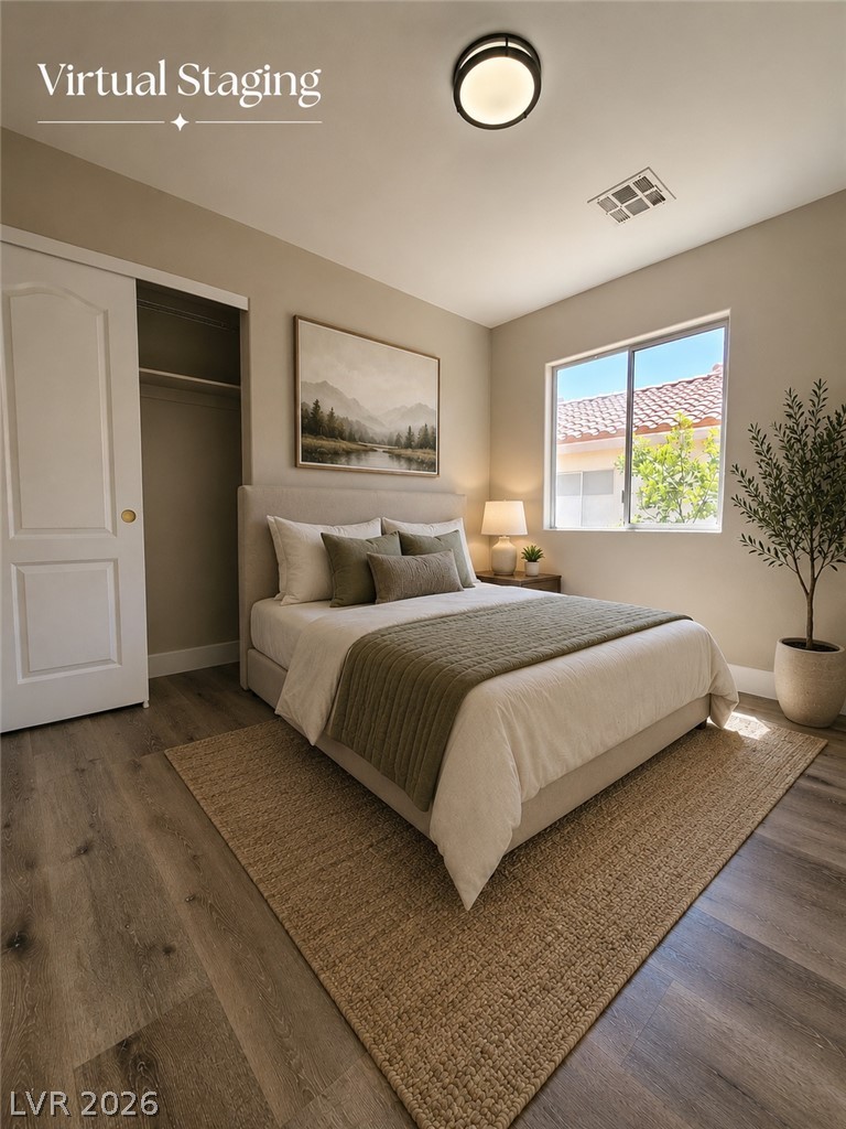 2278 Chestnut Ranch Avenue Henderson, NV 89052 - Photo 14 of 18 Relax in this tranquil bedroom, offering ample space and natural illumination through its wide window.