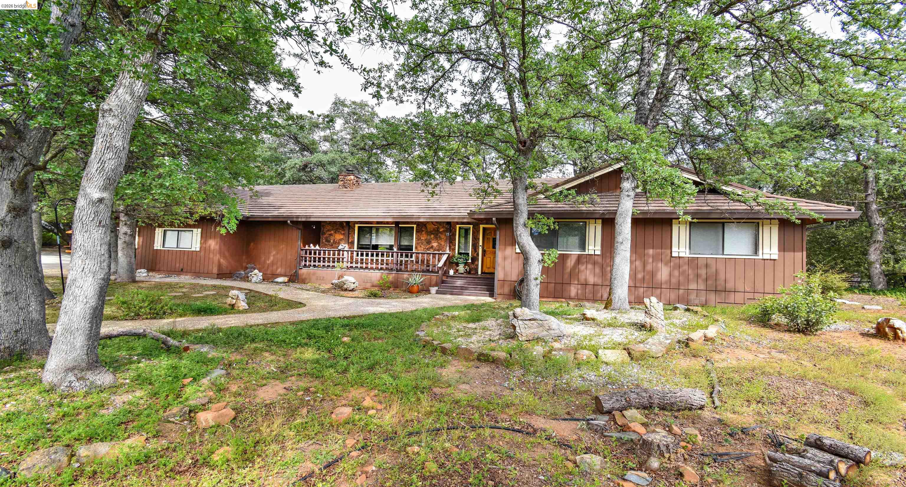 15 Roble Road Sonora, CA 95370 - Photo 2 of 44 View of front of property with covered porch and a chimney