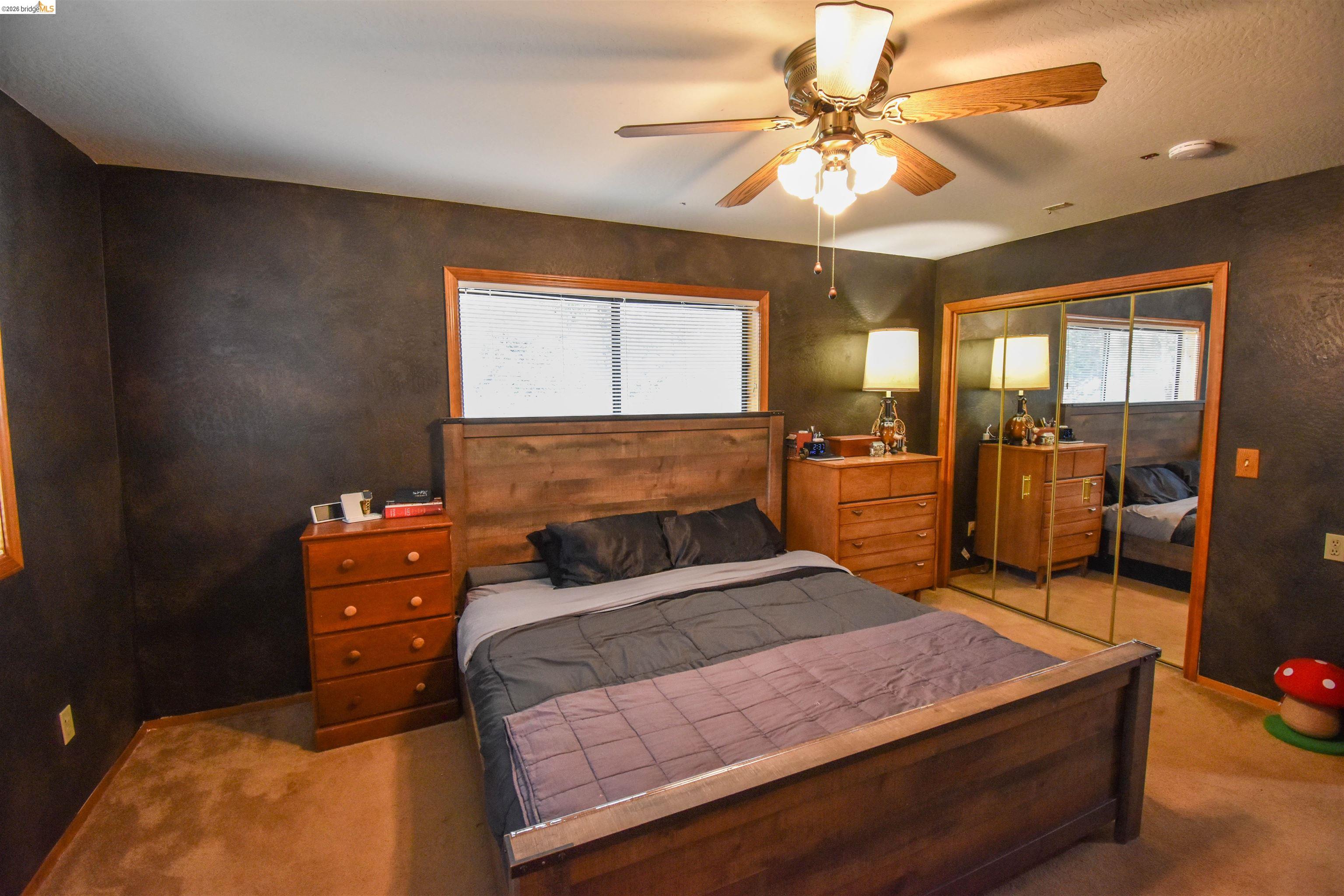 15 Roble Road Sonora, CA 95370 - Photo 31 of 44 Bedroom featuring carpet, a closet, and a ceiling fan