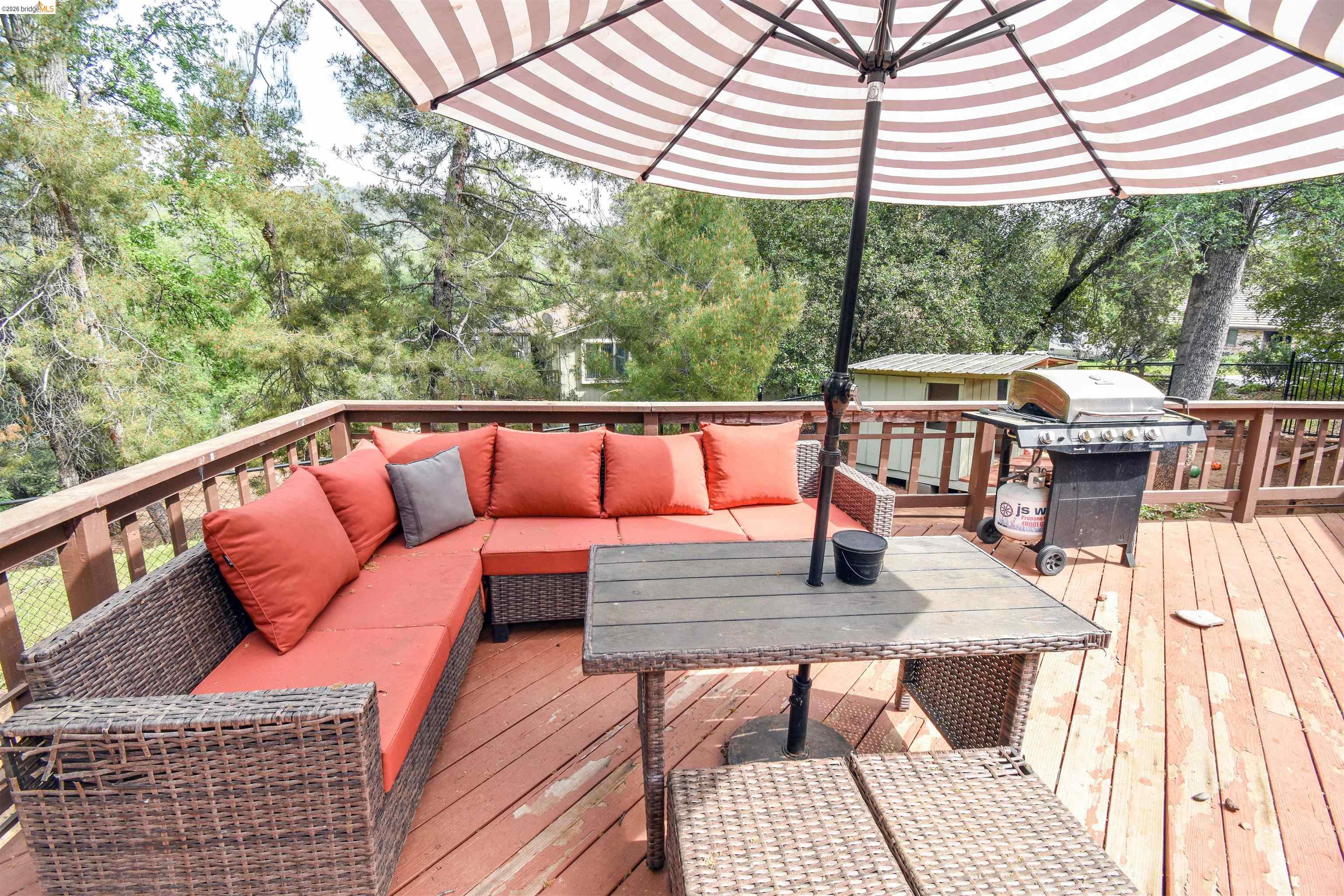 15 Roble Road Sonora, CA 95370 - Photo 39 of 44 Wooden terrace with area for grilling and an outdoor living / dining area