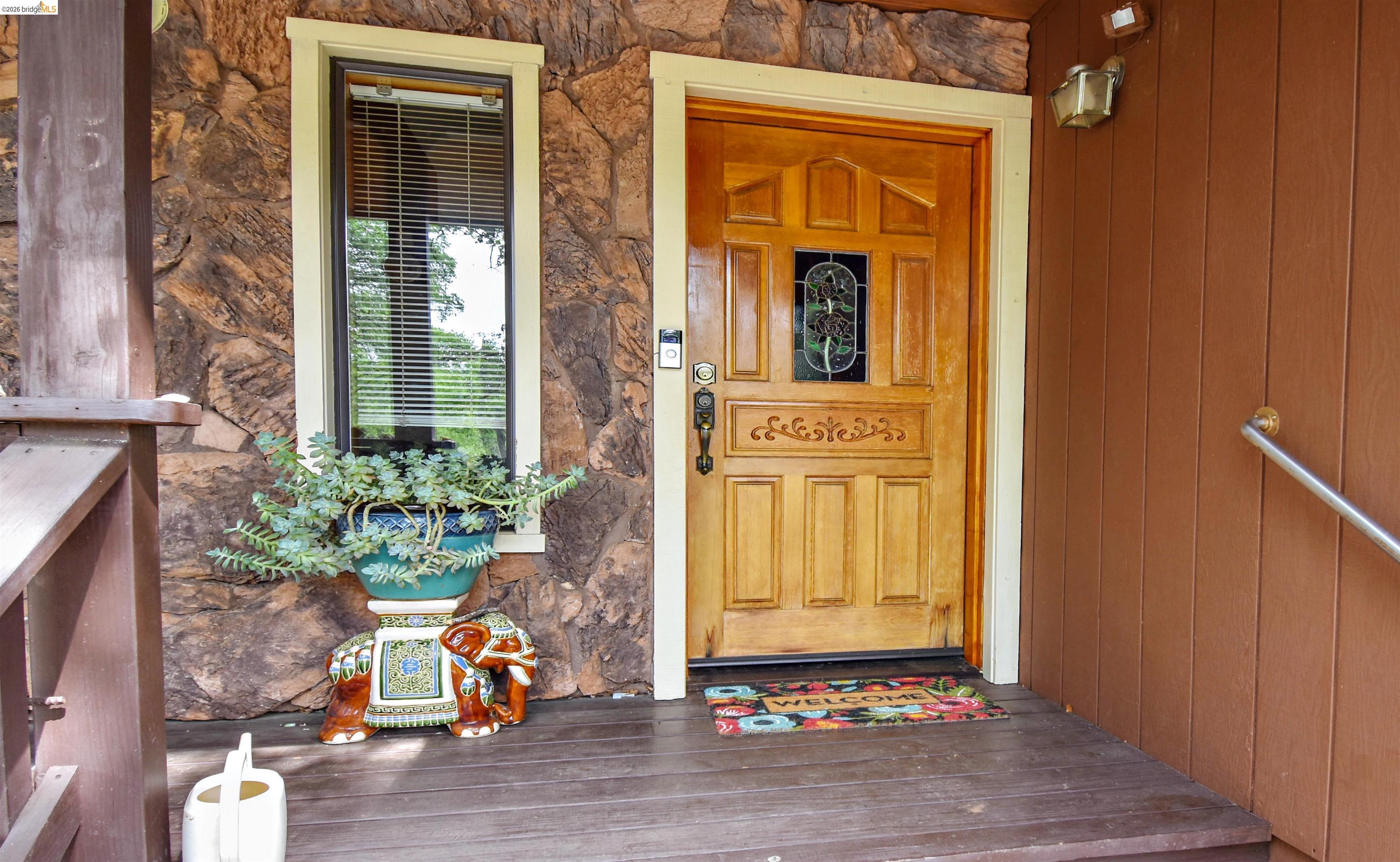 15 Roble Road Sonora, CA 95370 - Photo 7 of 44 Entrance to property with stone siding and a porch