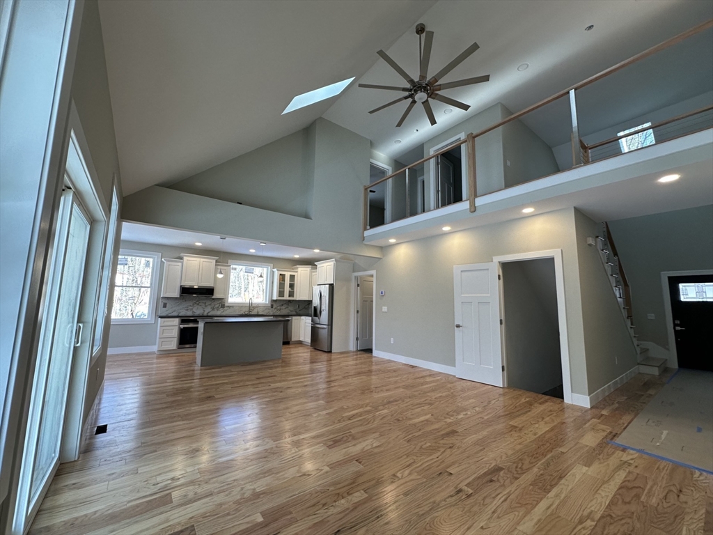 11 Rhodes Road Princeton, MA 01541 - Photo 10 of 40 a view of kitchen and dining room with wooden floor