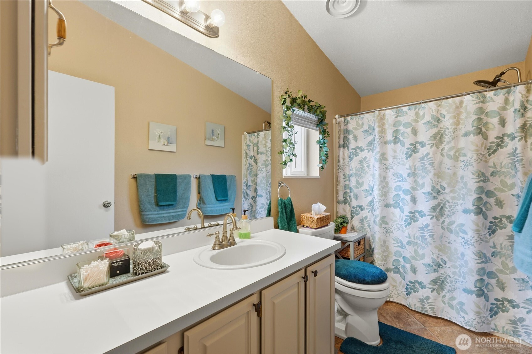 369 Gun Club Road, Unit 88 Woodland, WA 98674 - Photo 12 of 17 a bathroom with a toilet sink and mirror