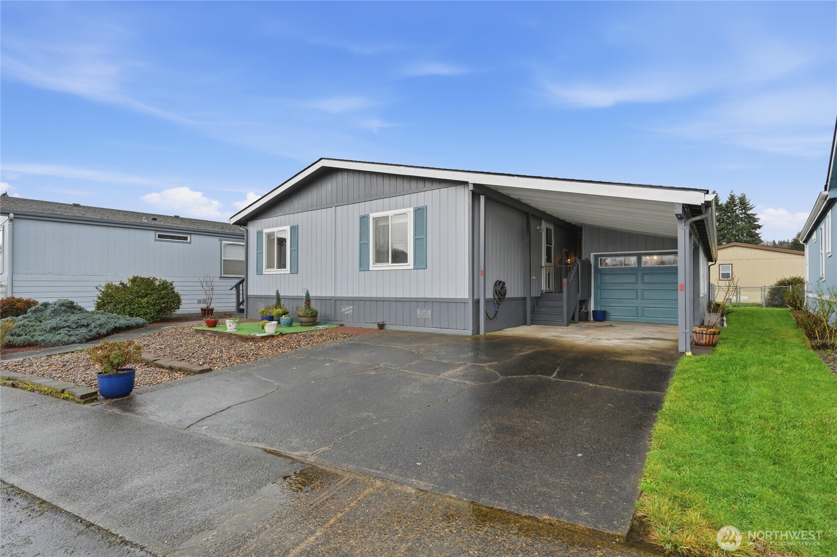 369 Gun Club Road, Unit 88 Woodland, WA 98674 - Photo 2 of 17 a view of a house with backyard and garden