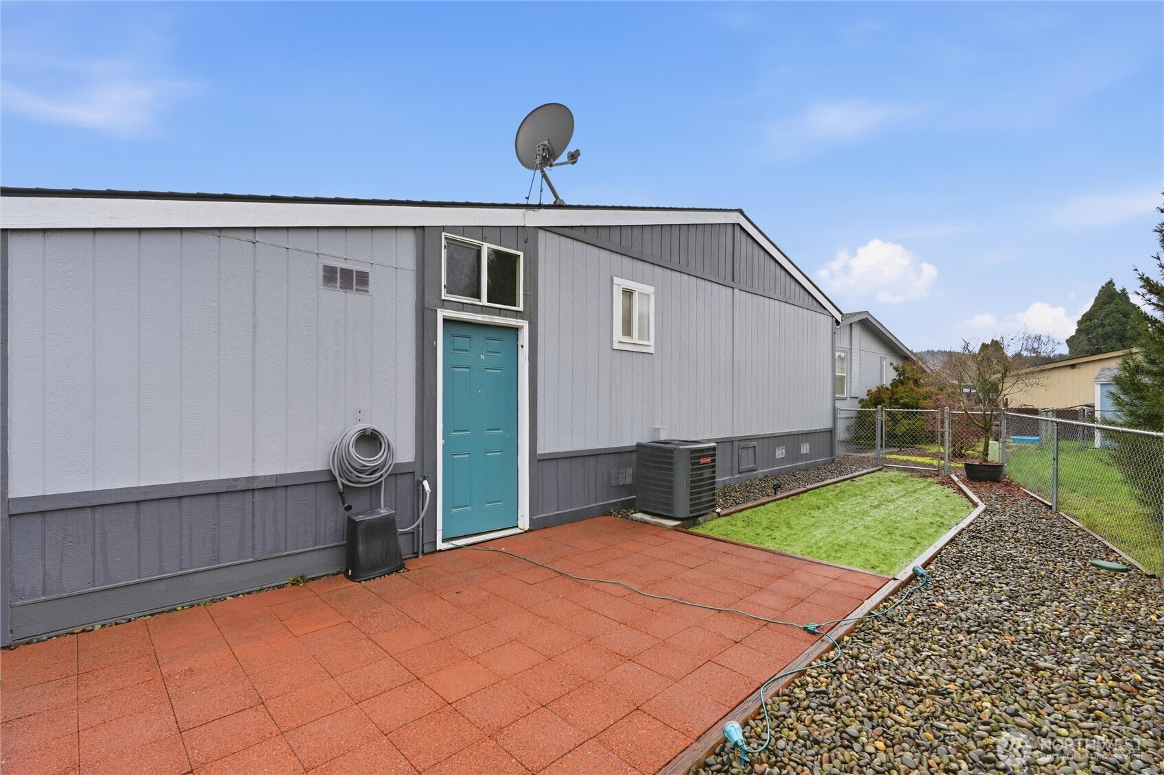 369 Gun Club Road, Unit 88 Woodland, WA 98674 - Photo 3 of 17 a front view of a house with garden