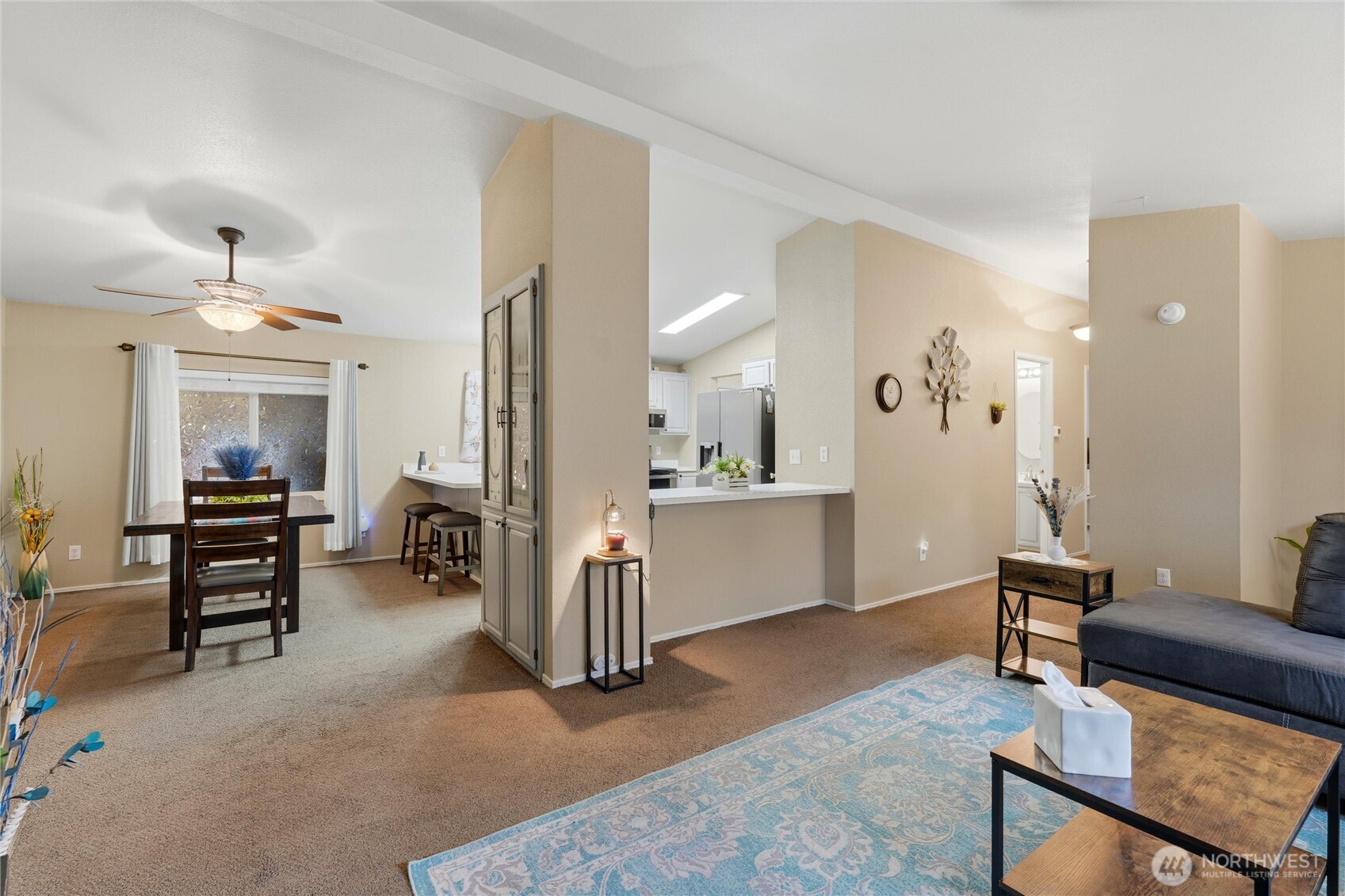 369 Gun Club Road, Unit 88 Woodland, WA 98674 - Photo 6 of 17 a view of a livingroom with furniture and a kitchen