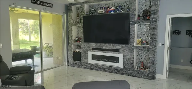 a kitchen with stainless steel appliances granite countertop a sink refrigerator and cabinets