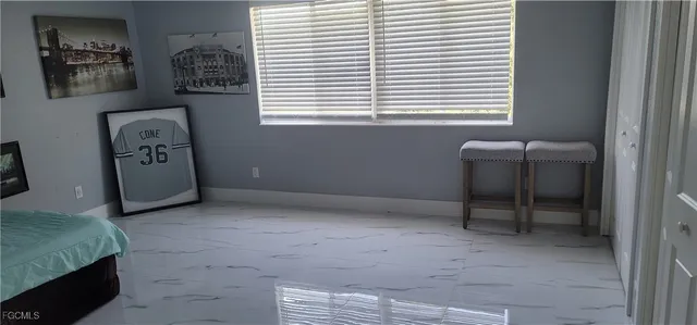 a view of workspace with window and couch