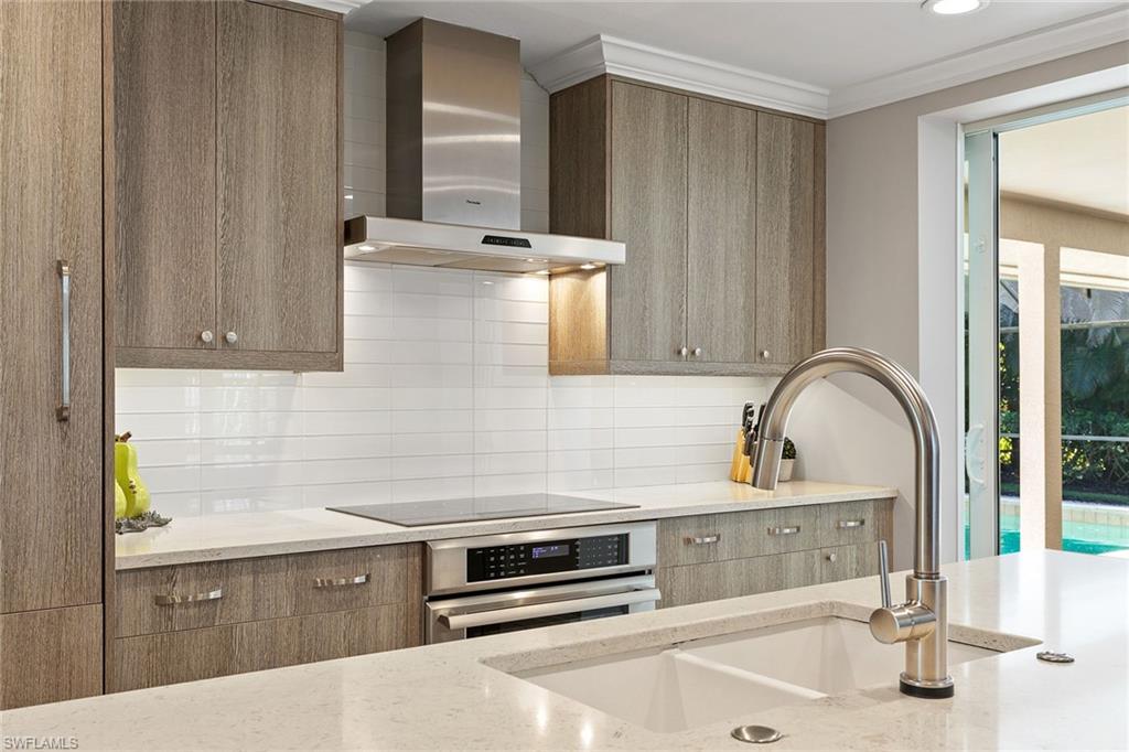 3720 Parkview Way Naples, FL 34103 - Photo 13 of 27 a bathroom with a sink and a mirror