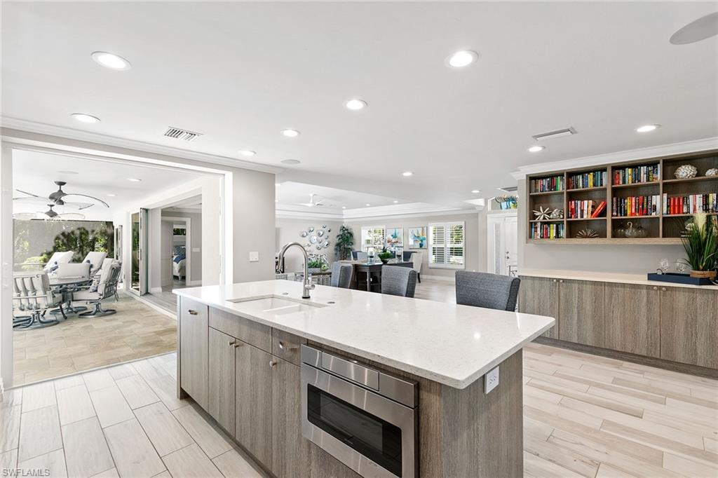 3720 Parkview Way Naples, FL 34103 - Photo 14 of 27 a view of a kitchen counter space and wooden floor