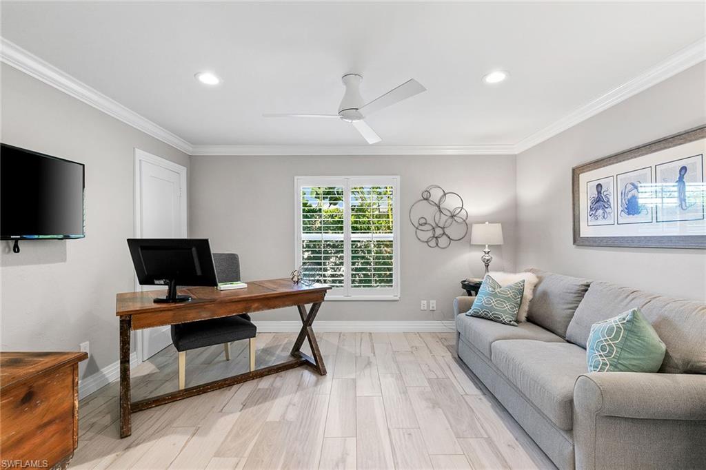 3720 Parkview Way Naples, FL 34103 - Photo 15 of 27 a living room with furniture and a flat screen tv