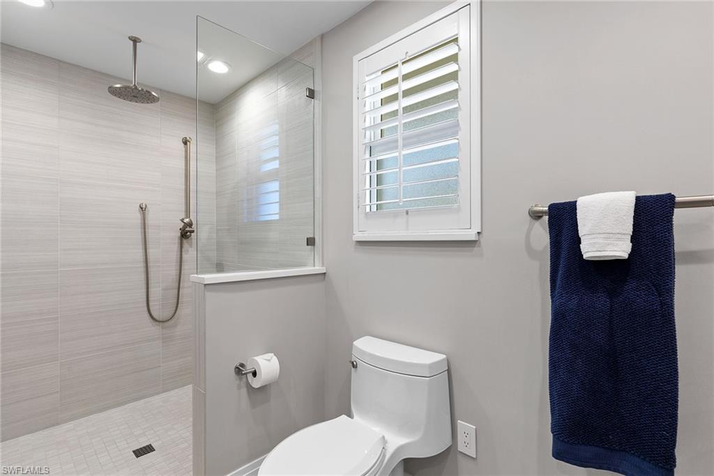 3720 Parkview Way Naples, FL 34103 - Photo 21 of 27 a bathroom with a toilet a sink and shower