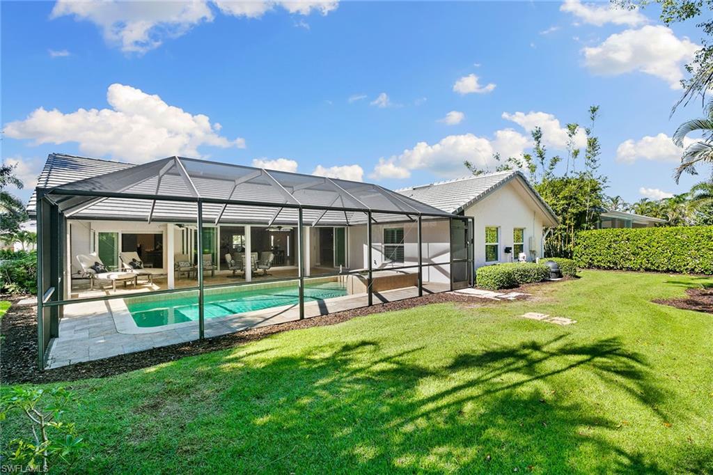 3720 Parkview Way Naples, FL 34103 - Photo 25 of 27 a view of a house with backyard and porch