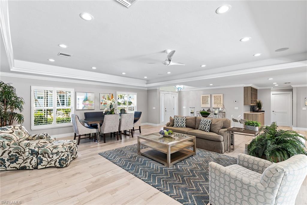 3720 Parkview Way Naples, FL 34103 - Photo 3 of 27 a living room with furniture and a large window