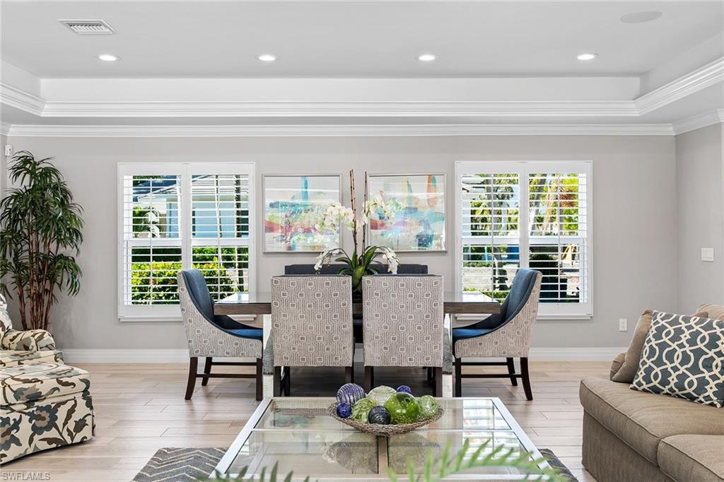 3720 Parkview Way Naples, FL 34103 - Photo 7 of 27 a living room with furniture and a large window