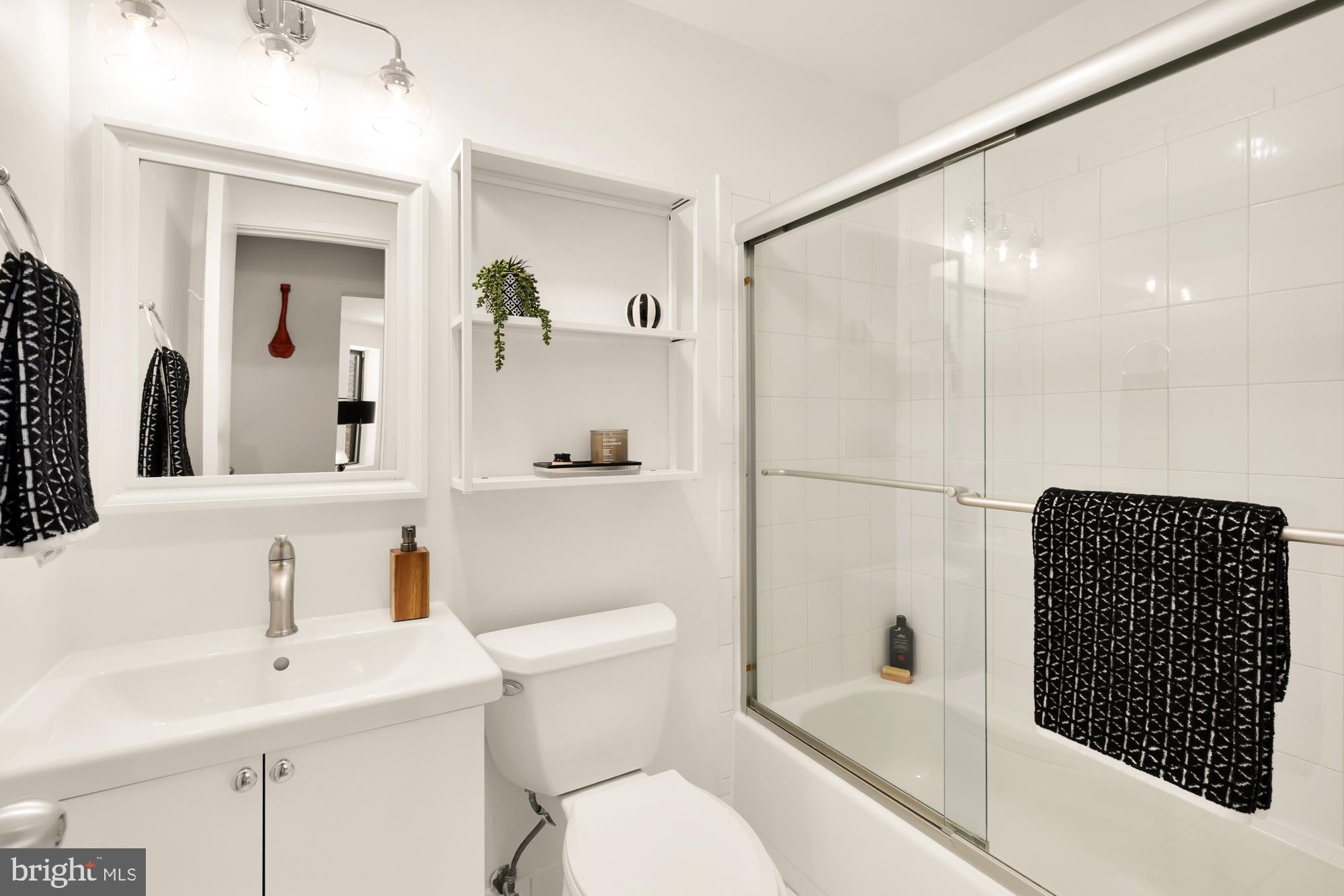 1844 Columbia Road Northwest, Unit 301 Washington, DC 20009 - Photo 14 of 21 a bathroom with a sink toilet and shower