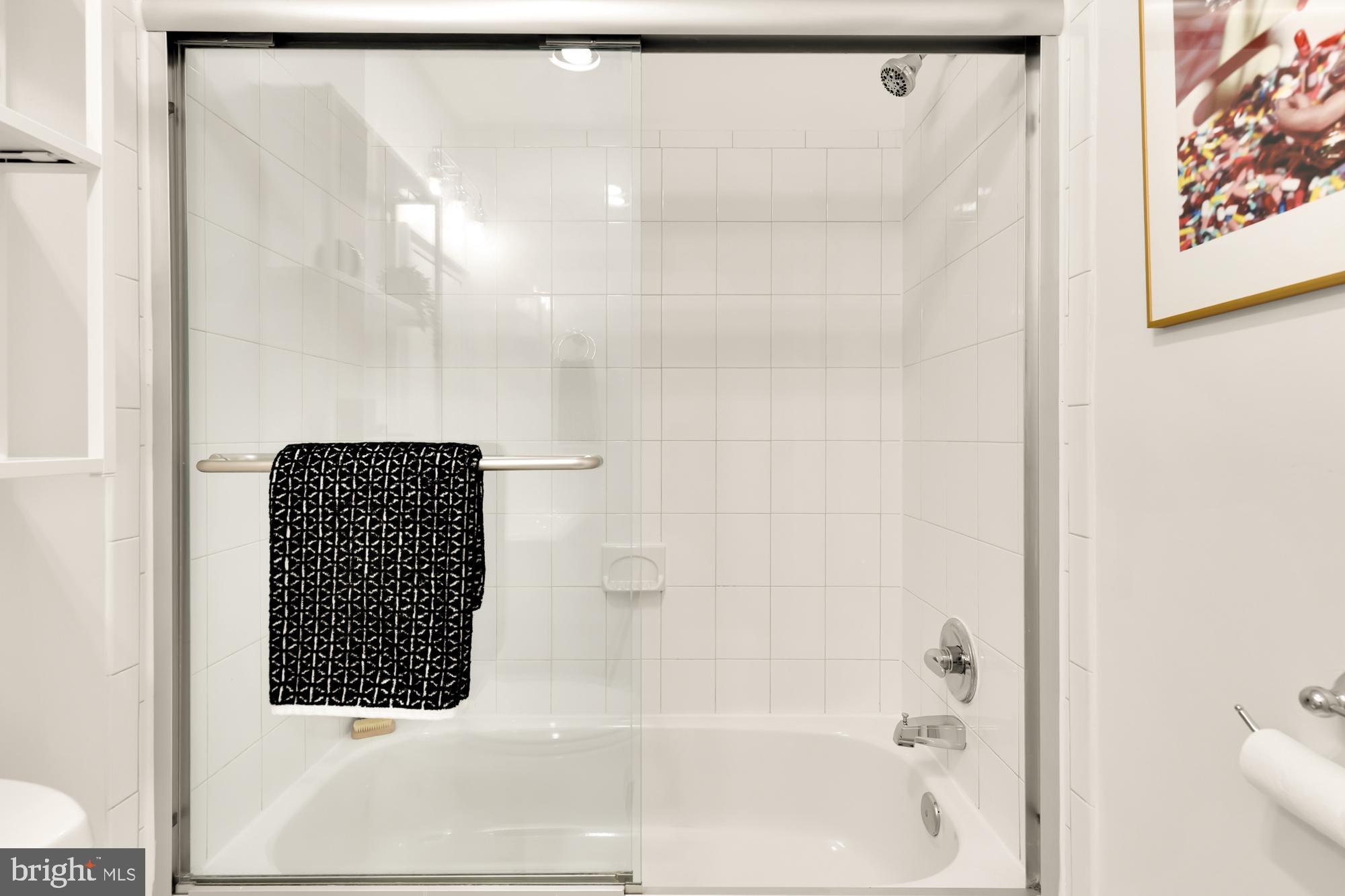 1844 Columbia Road Northwest, Unit 301 Washington, DC 20009 - Photo 15 of 21 a bathroom with a bathtub and shower