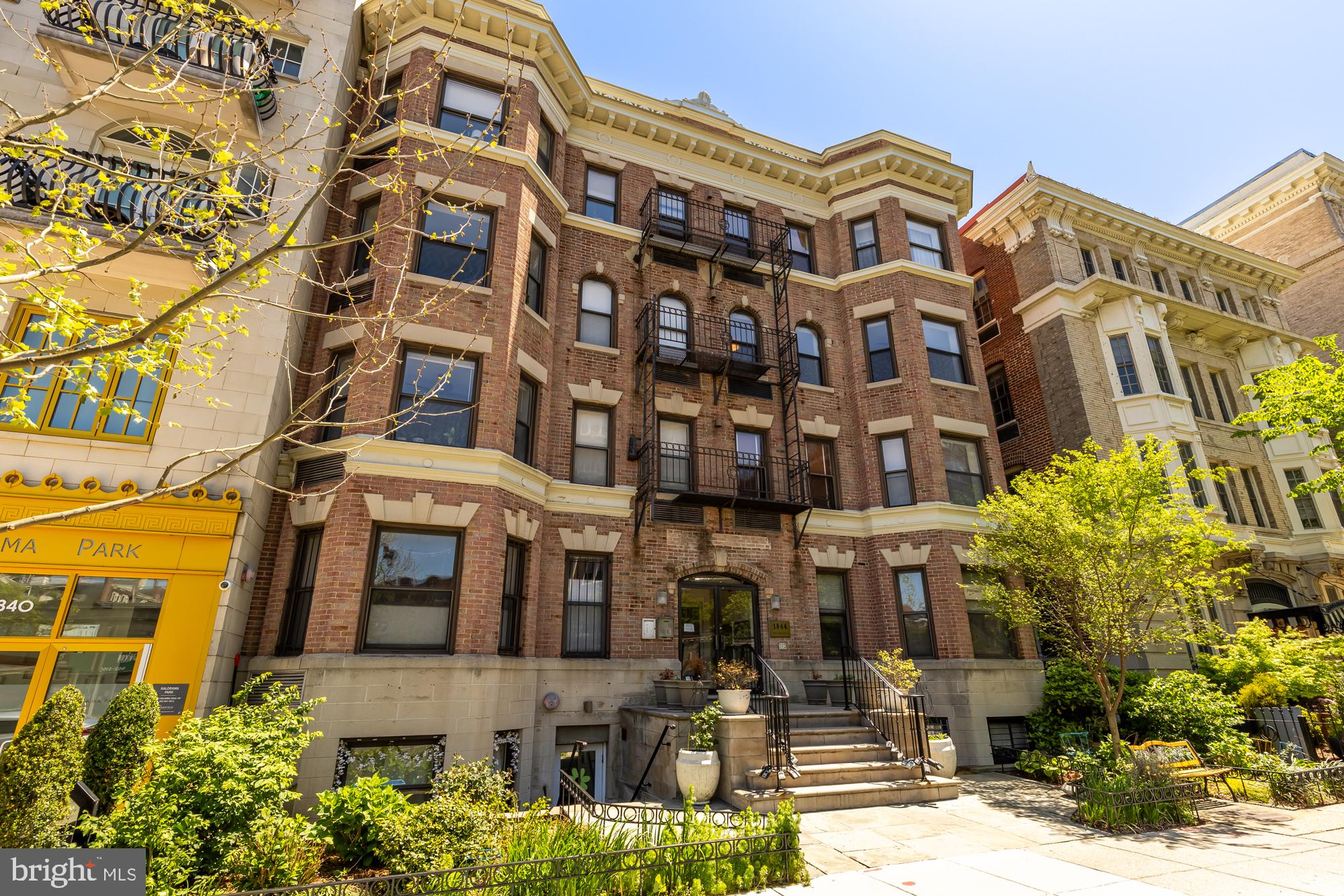 1844 Columbia Road Northwest, Unit 301 Washington, DC 20009 - Photo 16 of 21 a front view of a multi story residential apartment building