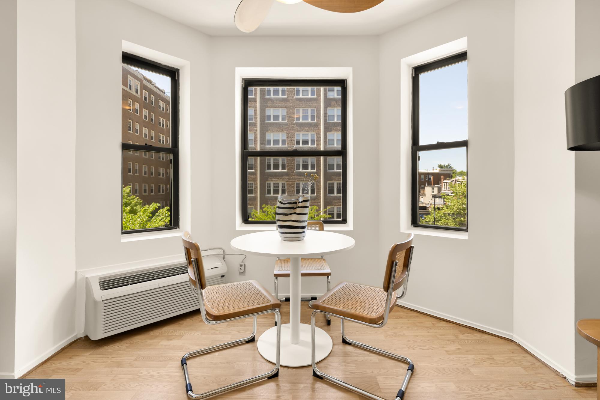 1844 Columbia Road Northwest, Unit 301 Washington, DC 20009 - Photo 3 of 21 a dining room with furniture and window