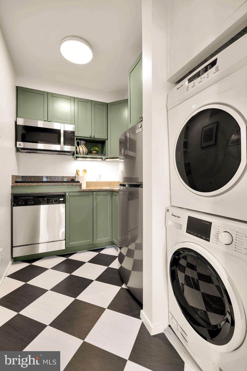 1844 Columbia Road Northwest, Unit 301 Washington, DC 20009 - Photo 6 of 21 a kitchen with a sink and a washer dryer