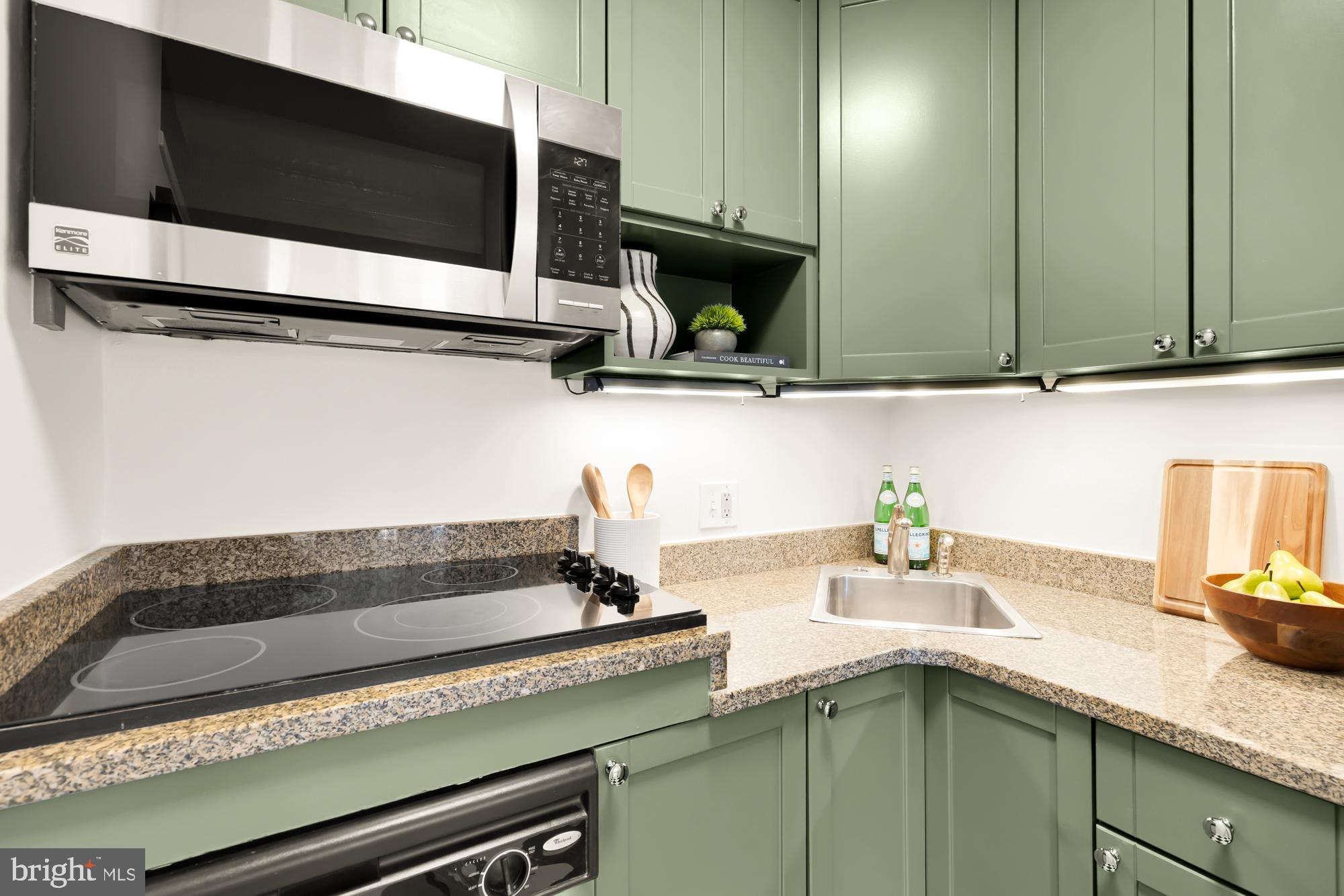 1844 Columbia Road Northwest, Unit 301 Washington, DC 20009 - Photo 8 of 21 a kitchen with a sink and cabinets