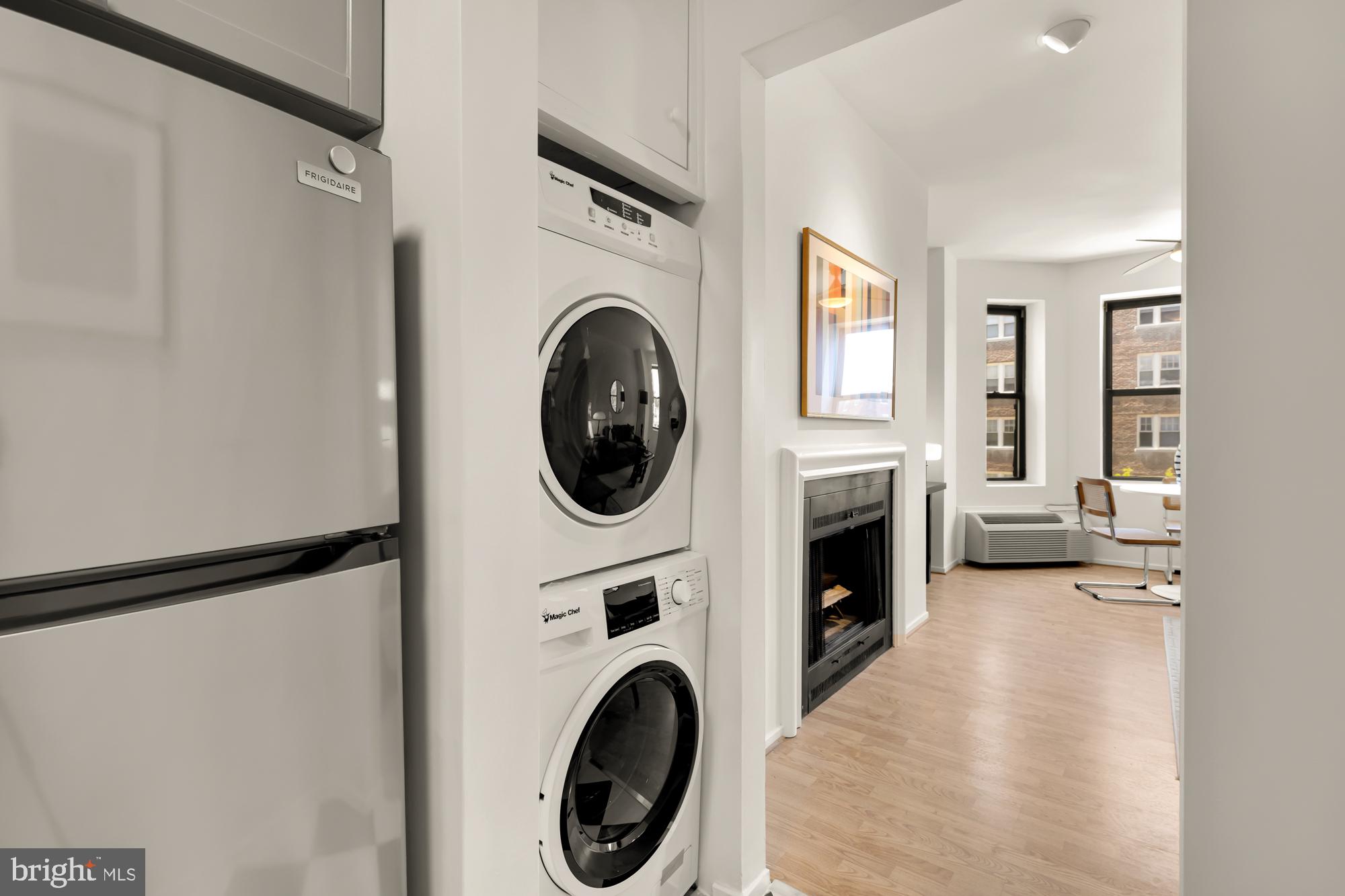 1844 Columbia Road Northwest, Unit 301 Washington, DC 20009 - Photo 9 of 21 a view of a hallway with washer and dryer