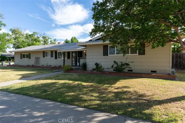 a view of a house with swimming pool and sitting area