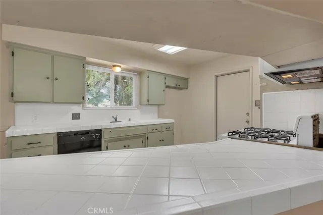 a spacious bathroom with a bathtub sink and mirror