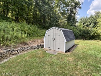 9424 Brookside Road Independence, OH 44131 - Photo 20 of 21 Handsome shed to accommodate your lawnmower, snowblower, garden tools, bicycles, etc.