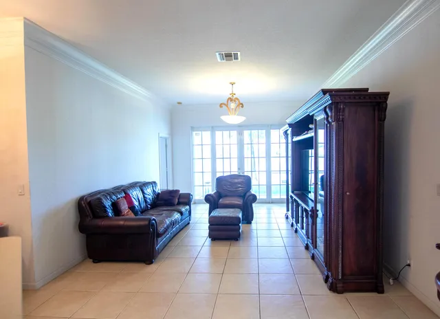 a white bath tub sitting in a bathroom next to a window
