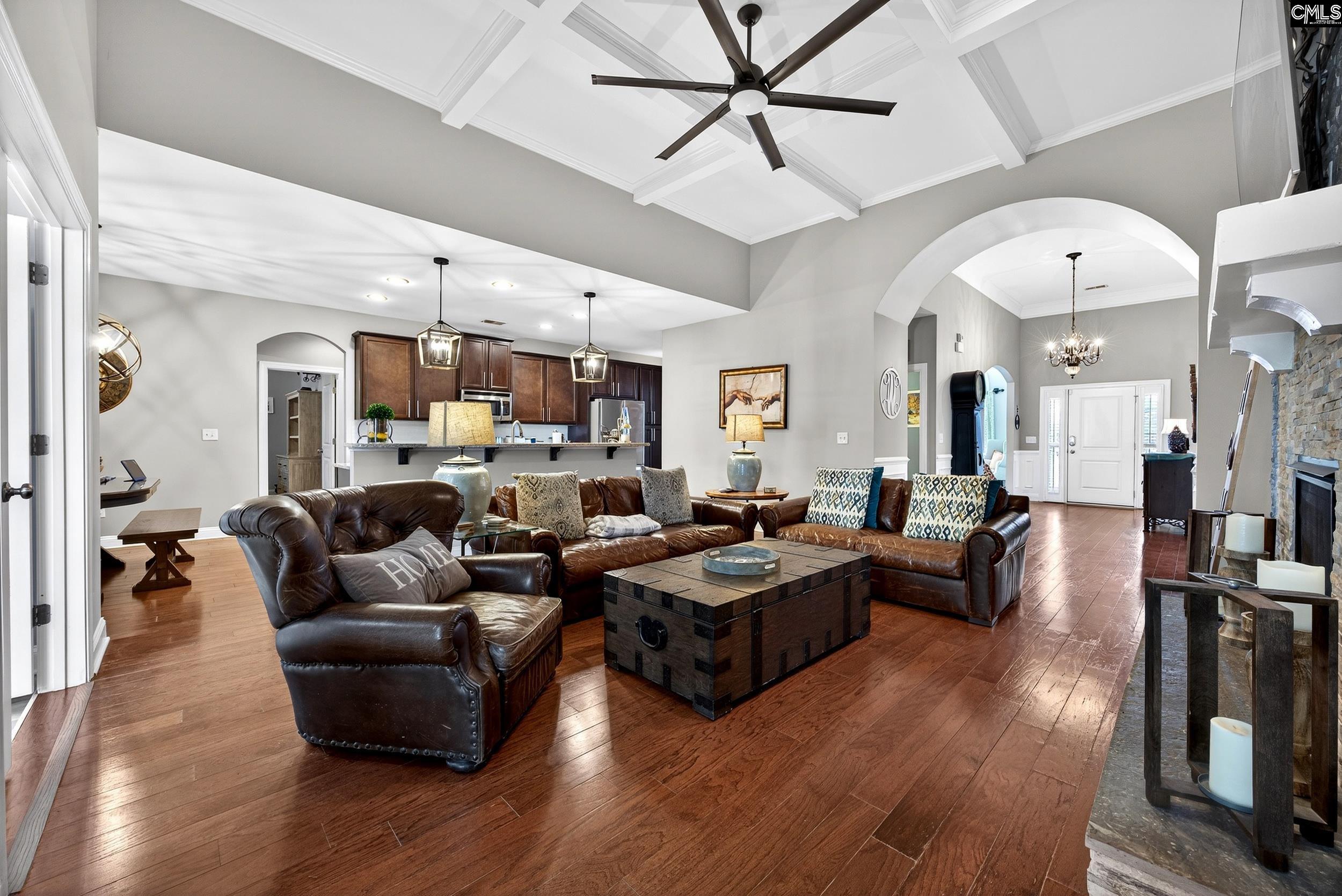 116 Renard Way Gilbert, SC 29054 - Photo 20 of 74 a living room with furniture kitchen view and a wooden floor